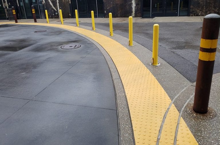 Liquid-applied tactile warnings